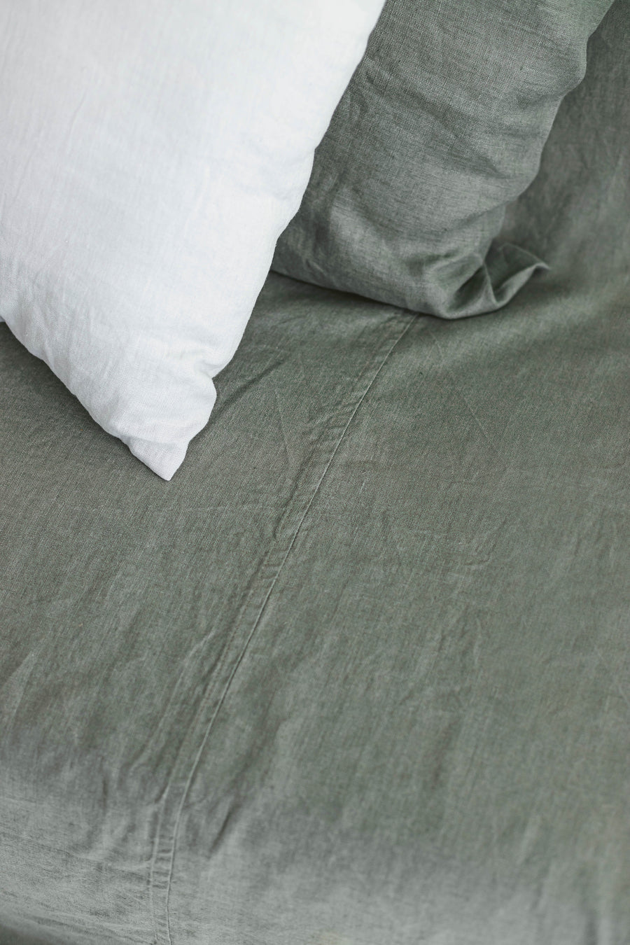 Green linen sofa cover.