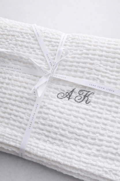 White linen cotton waffle towel with embroidered initials