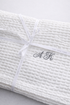 White linen cotton waffle towel with embroidered initials