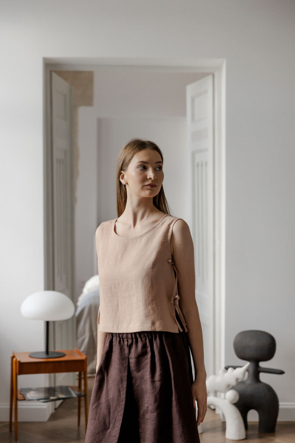 Sleeveless linen top with side tie details in peach linen
