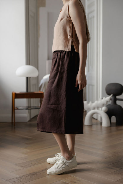 Sleeveless linen top with side tie details in peach linen