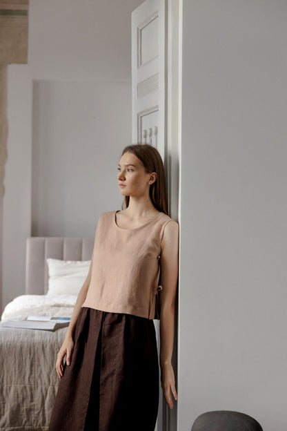 Sleeveless linen top with side tie details in peach linen