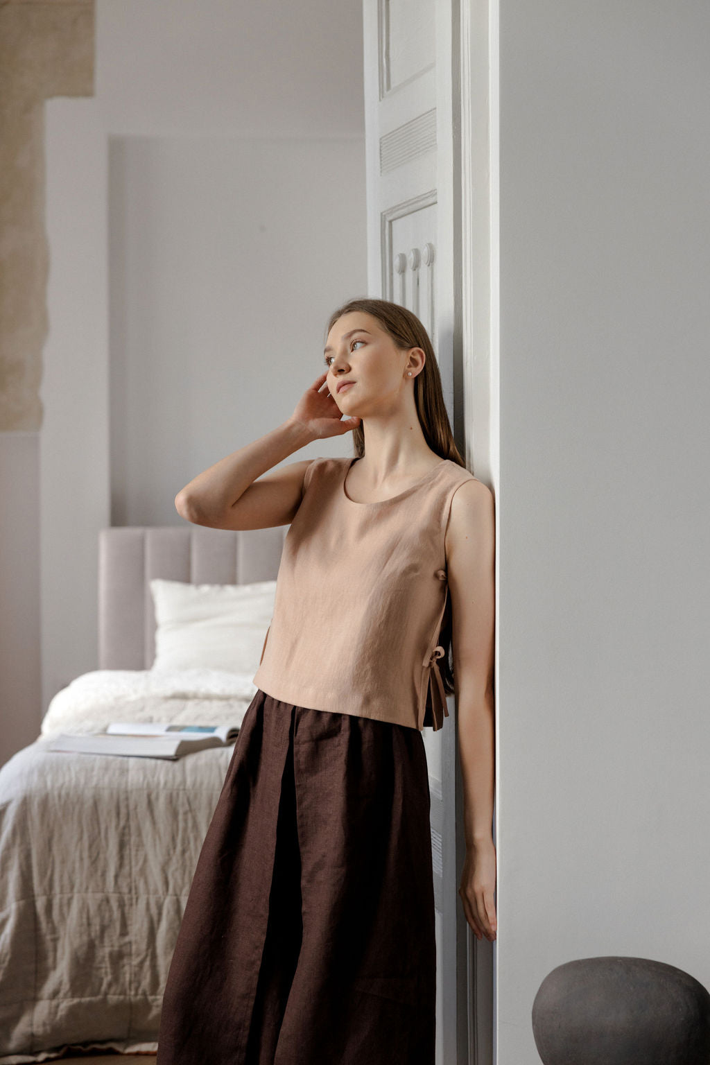 Sleeveless linen top with side tie details in peach linen