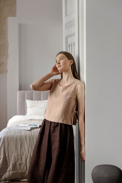 Sleeveless linen top with side tie details in peach linen