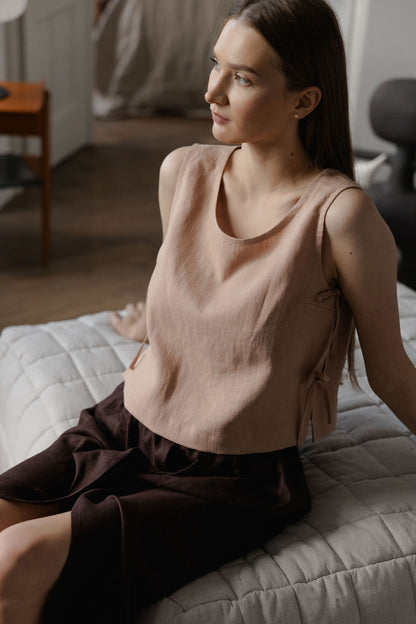 Sleeveless linen top with side tie details in peach linen