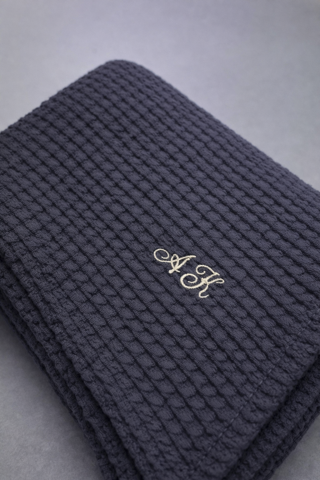 Dark gray textured linen cotton towel with a monograme
