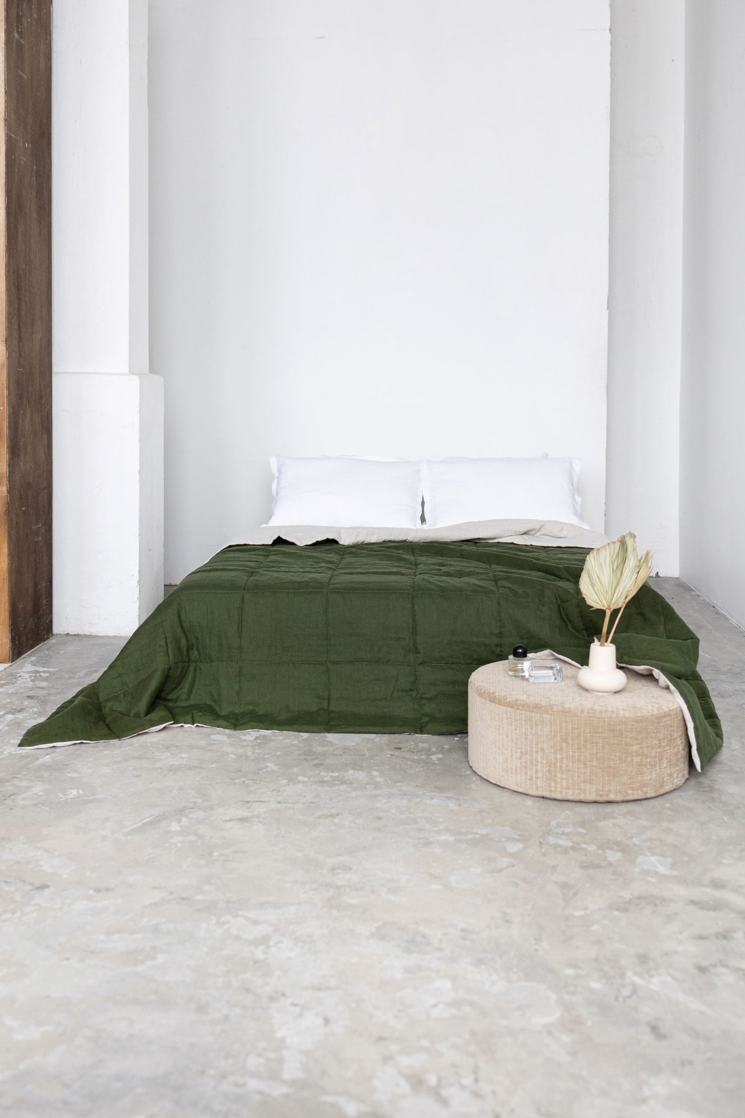 Dark green quilted linen bedspread