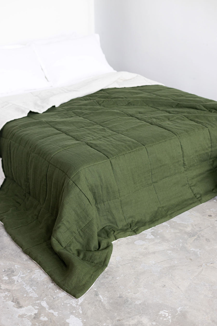 Dark green quilted linen bedspread